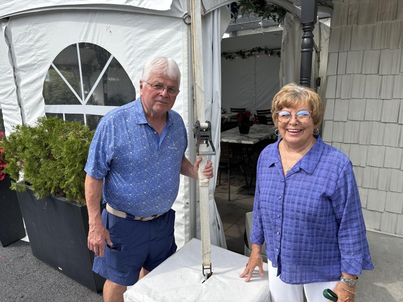 Mom and dad at the tent admiring the good job